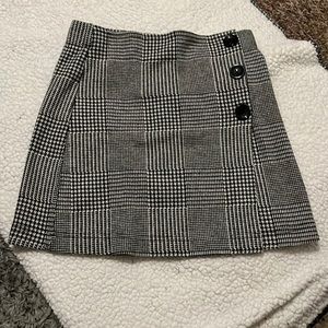 Plaid skirt from Forever 21 with cute buttons! Size small. Never worn.
